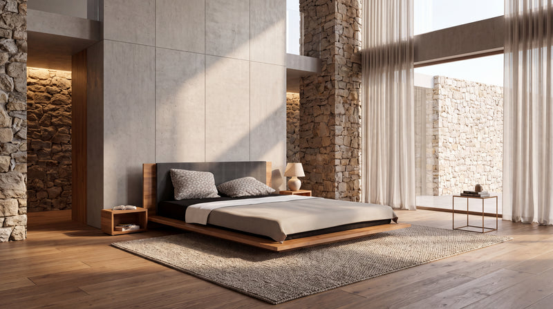 Eingerichtetes Schlafzimmer mit Holzbett, Naturstein und Tageslicht